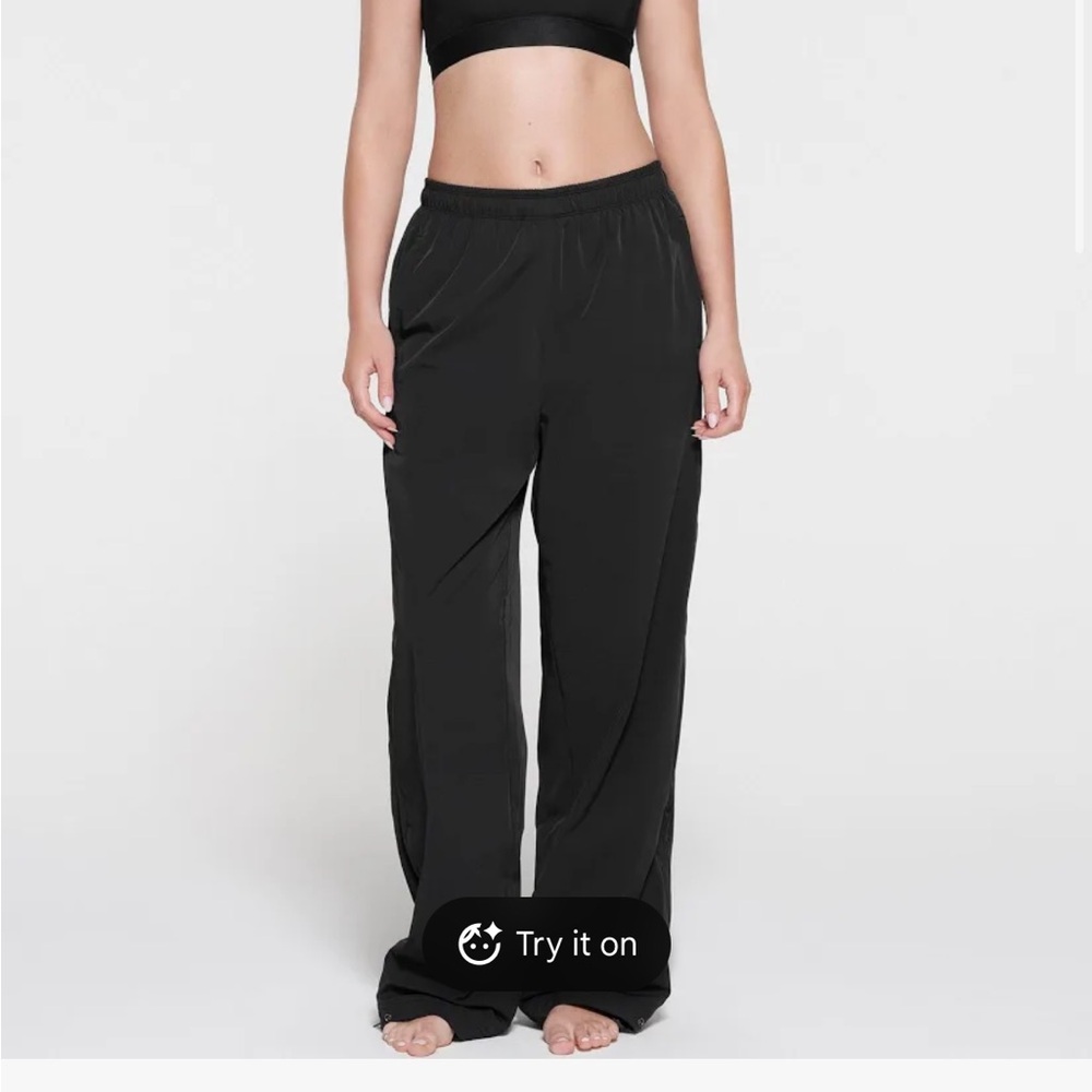 SKIMS track pants